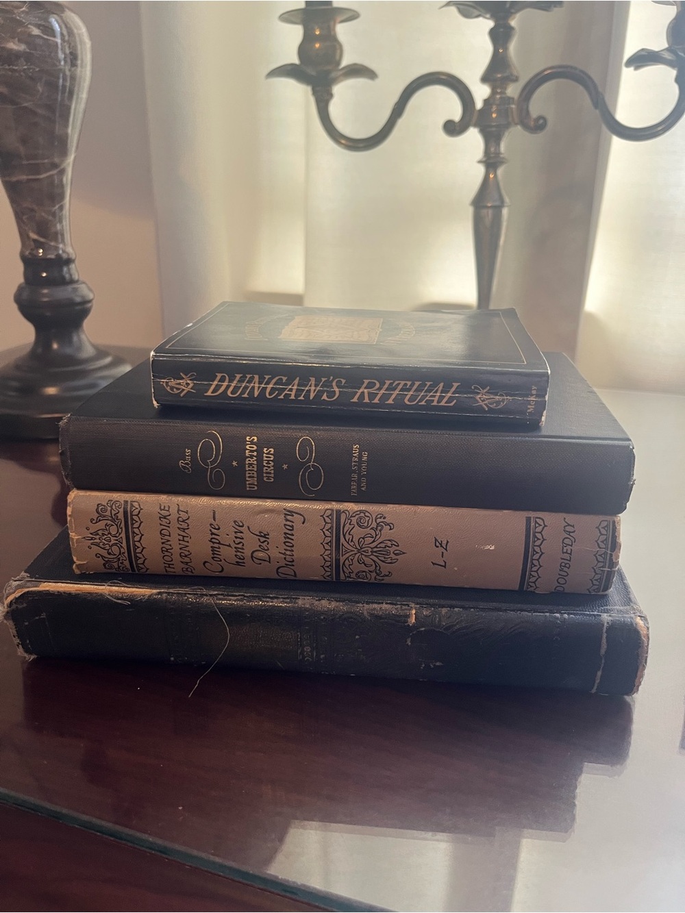 Vintage 1939-1976 black and beige book set.